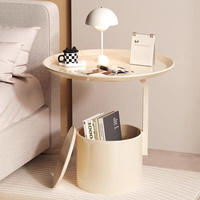 Table basse ronde compacte en acier design, mobile et écologique pour les salons modernes