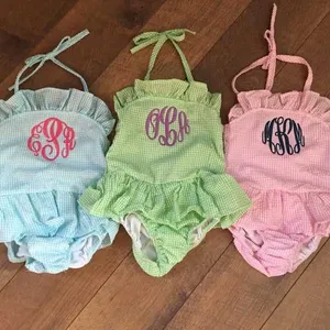 夏季女婴沙滩个性化单件字母组合女孩褶边棉泡泡纱泳衣