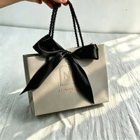 Sacs en papier personnalisés pour vêtements, emballages cadeaux, sacs de shopping de luxe, sacs en papier populaires avec votre propre logo