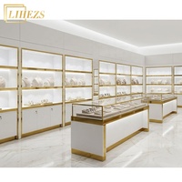 Vitrine de présentation de bijoux haut de gamme en or blanc avec comptoir en verre trempé