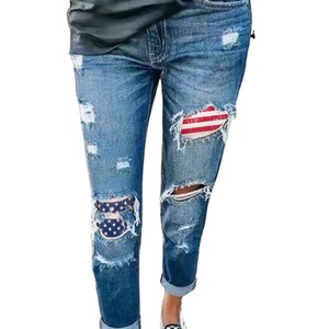 I buchi strappati delle donne europee e americane mostrano <span class=keywords><strong>Jeans</strong></span> e pantaloni sottili stampati a stelle e strisce - Product Image 1