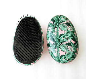 <span class=keywords><strong>Cepillo</strong></span> Desenredante Portátil con Forma de Huevo para Mujeres y Niños, Peine Masajeador Antienredos para el Cuero Cabelludo - Product Image 1