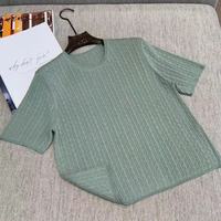 Pull en tricot fin à col rond rétro pour l'été, haut uni à manches courtes et coupe ajustée pour femmes