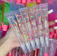 Lipgloss Dasar Label Pribadi Bening Kustom Mesin Gantungan Kunci Buah Roll Pada Tabung Buah Make Up Berkilau Vegan Grosir Lip Gloss