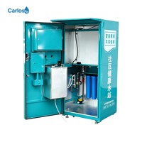 Distributeur d'eau pure Carlos avec plusieurs modes de paiement et écran publicitaire pour la communauté