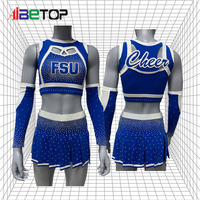 Tenues de cheerleading bleu et blanc scintillantes, jupe plissée fendue, uniforme de cheerleading avec manches longues pour les spectacles des adolescentes