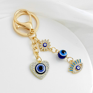 Nouveau porte-clés créatif en strass avec symbole porte-bonheur, œil protecteur, plaqué or, breloque cœur œil bleu pour la protection et la décoration de sac - Product Image 5