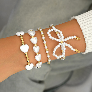 European and American cross-border elegant and versatile heart-shaped faux pearl <b>bracelet</b> four-piece <b>set</b> with bow stacking - Product Image 2