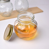 Vente en gros de pots à miel en verre transparents vides de 280 ml, 380 ml, 480 ml, forme unique, pour la conservation domestique, avec couvercle en métal