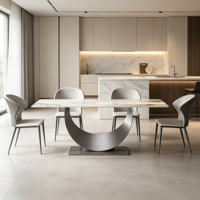 Table à manger rectangulaire minimaliste italienne en pierre frittée avec base incurvée en acier inoxydable brossé, mobilier de maison robuste