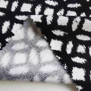 Tessuto stampato in crêpe effetto muschio bianco e nero per vestiti da ragazza, bestseller 2026 - Product Image 1