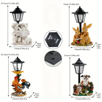 Lanterne solaire en résine en forme de famille de lapins, peinte à la main, style fantaisie, avec détails floraux, pour éclairage décoratif de jardin