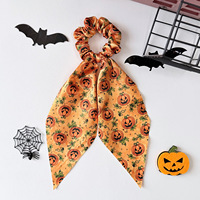 Nouveau serre-tête Halloween avec un imprimé fantaisie citrouille en satin pour filles, doté d'un grand nœud à l'arrière de la queue de cheval.