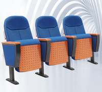 Chaise de théâtre rotative rembourrée en tissu rouge élégant et pratique avec bureau en bois rabattable pour auditoriums et conférences