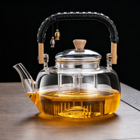 Théière en verre résistant aux hautes températures avec poignée, design moderne et minimaliste, pour la préparation du thé à la maison, compatible avec les plaques électriques en céramique