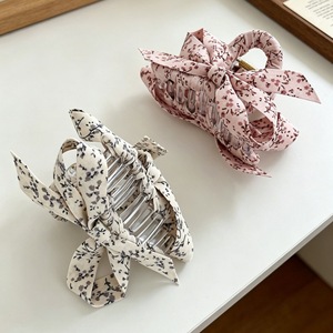 Korean style small floral fabric wrap-around crisscross hair <b>clip</b>, a popular and simple hair accessory for updos. - Product Image 3
