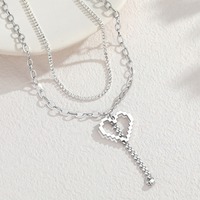 Collier double couche tendance avec pendentifs cœur ajourés uniques, accessoires chics en acier inoxydable, bijoux de mode 2026 TGXL14772