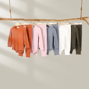 Autumn Casual Ribbed Cotton Baby Clothing ODM Supply Long Sleeve Pullover T-Shirt with Curved Hem Pocket Toddler Set with Pants