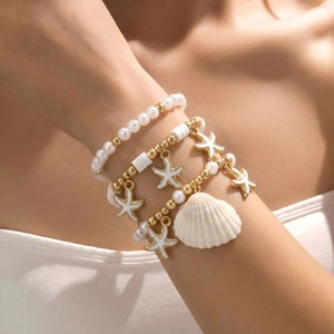 ชุดกำไลข้อมือเปลือกหอยปลาดาวสไตล์โบฮีเมียนประดับมุกเทียม ชุดเครื่องประดับแฟชั่นชายหาดสำหรับทุกเพศ - Product Image 1