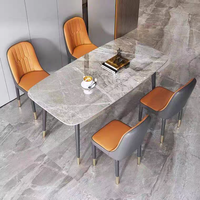 Ensemble de table à manger de luxe nordique avec structure en fer, durable et imperméable, 4 chaises pour hôtel ou restaurant