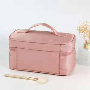 Bolso de viaje impermeable con logotipo personalizado para mujer, bolsa de cosméticos de nailon rosa con cremallera, 2023