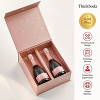 Boîte cadeau mini champagne personnalisée double bouteille en carton rose doré perlé avec étoile argentée en feuille d'aluminium, format fête, emballage champagne