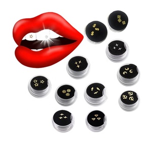 Vente en gros de <span class=keywords><strong>bijoux</strong></span> dentaires personnalisés en cristal plaqué or 18 carats avec <span class=keywords><strong>colle</strong></span> <span class=keywords><strong>pour</strong></span> décoration de blanchiment des dents DIY, emballage en boîte réutilisable - Product Image 1
