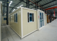Conteneur habitable extensible 20 pieds blanc ivoire avec salle de bain et cuisine, disponible en 20 et 40 pieds, idéal pour le glamping et les unités résidentielles complémentaires (ADU) - Prix réduit