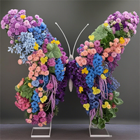 Arc de papillon de rangée de fleurs artificielles réalistes faites à la main pour décor de boutique de toile de fond de mariage caractéristique de Noël