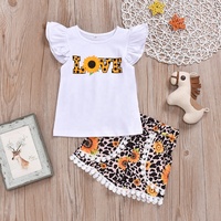 Ensemble de vêtements pour enfants en bas âge très vendu, t-shirt à manches courtes à volants imprimé, short à franges, deux pièces, vêtements d'été pour filles