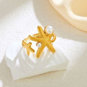 Vente en gros de nouvelles bagues en acier inoxydable plaqué or 18 carats, style vintage, mignonnes, en forme d'étoile de mer, pour femmes - Product Image 1