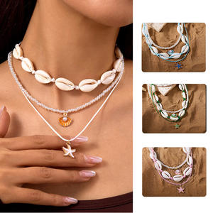 <span class=keywords><strong>Collier</strong></span> de style bohème européen et américain de vacances Summer Beach Dopamine Starfish Shell Pearl Layered Necklace - Product Image 1