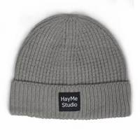 Bonnet tricoté uni streetwear hiver en promotion avec étiquette tissée personnalisée