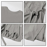 Ensemble de tenue de sport 2-en-1 pour femme : jupe de tennis unie sans dos et combinaison de sport à manches longues avec short intégré