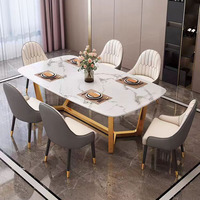 Ensemble de table à manger moderne Hanyee avec 6 chaises, plateau en ardoise grise italienne, structure en acier carbone doré, mobilier haut de gamme pour salle à manger
