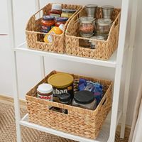 Panier de rangement tissé en rotin naturel avec poignées intégrées