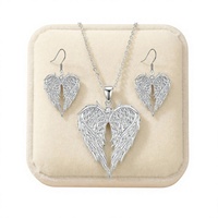 Collier et boucles d'oreilles de luxe légers en alliage électroplaqué, motif ailes d'ange et ailes en forme de cœur, pour femme, vente chaude transfrontalière