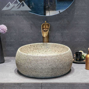 Lavabo rond sur plan en céramique texturée motif pierre Wayon pour projet hôtelier de luxe - Product Image 1