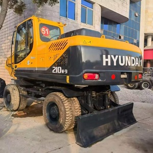 Excavatrice sur roues Hyundai 210W-9, 21 tonnes, jaune et noire, équipement de construction d'occasion avec moteur, pompe et alternateur - Product Image 1