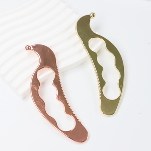 Outil de massage facial Gua Sha en acier inoxydable 304 en forme de dauphin - Product Image 1