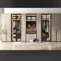 Solution de rangement : Armoire moderne en bois clair avec cadre noir, éclairage intelligent, rangement multi-zones, système de suspension et de tiroirs pliables