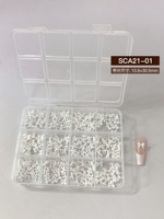 Vente chaude : Kit de 12 compartiments de strass pour ongles en résine, nœuds, perles, cristaux et fleurs pour salon de beauté