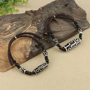 Pulsera de estilo étnico hecha a mano con cuentas de cielo de nueve ojos exquisitas, cuerda trenzada con cuentas religiosas budistas, brazalete de oración de madera Retro