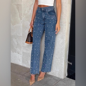 Jeans de mujer de moda con cintura asimétrica, diseño cruzado frontal, vintage, con cuentas, pierna recta y bajo deshilachado - Product Image 1