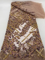 Le nouveau tissu brodé de sequins floraux 2026 est adapté aux robes de mariée, tissu luxueux et résistant avec des perles