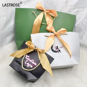 Hot selling shopping paper bags with logos wholesale top quality luxury handbags for women private label reusable shopping bag