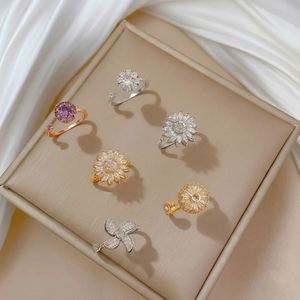 Women cross-border micro-inlaid flower Rotation <b>Ring</b> OEM ODM Service Luminous Inlay Solid Metal Construction Mixed wholesale - Product Image 3