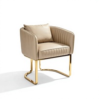 Fauteuil d'appoint moderne en similicuir rembourré avec structure en métal doré pour salon