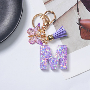 Llavero <span class=keywords><strong>de</strong></span> resina morada con letras del alfabeto, colgante para bolso, 26 letras inglesas, borla morada, mariposa, llavero con inicial - Product Image 4