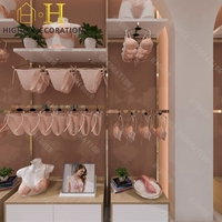 Comptoir en bois de haute qualité avec éclairage LED pour l'affichage de lingerie personnalisée en magasin, idéal pour la vente au détail